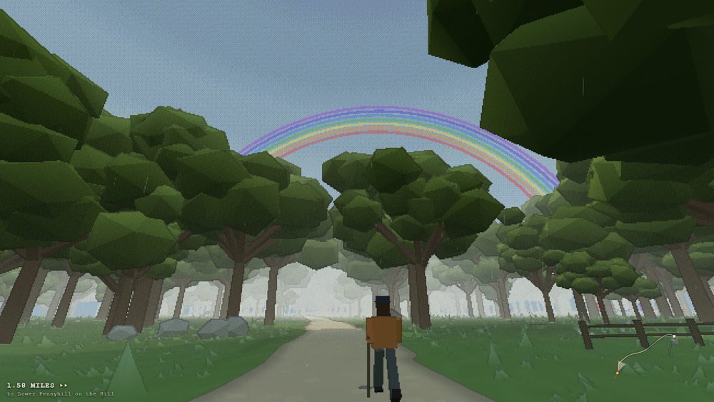 Walker on a woodland path under a rainbow
